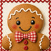 Gingerbread boy 10 inch metal Christmas sign with smiling face, red and white gingham bow tie, red buttons, white icing details and red decorative border, TTE-689.