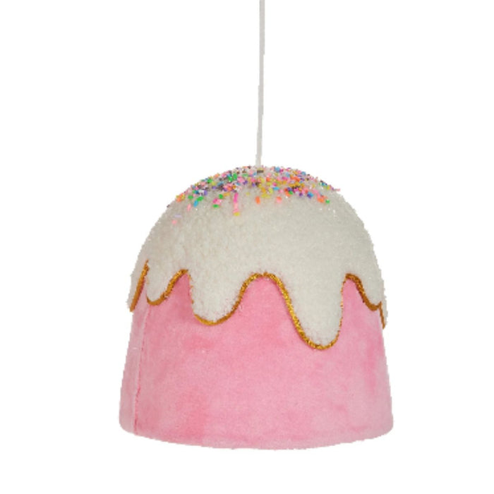 Four 6" Gumdrop Button Ornaments (4503495) shaped like frosted cakes in blue, pink, red, and green with white icing and sprinkles hang by white strings—part of the Holly Jolly Holiday Collection.