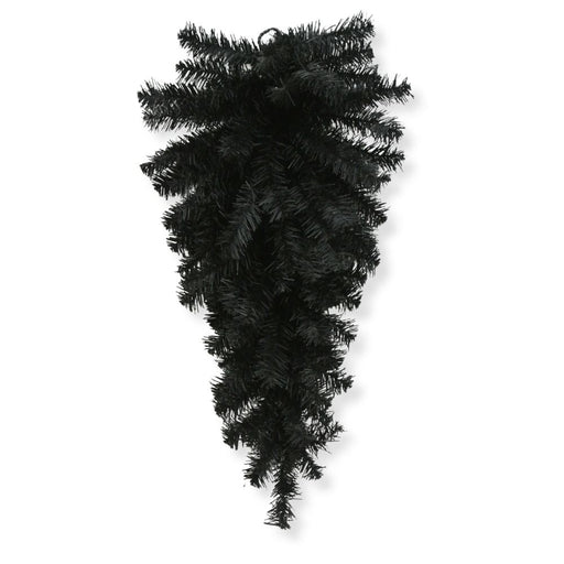 The 24" Black Artificial Pine Teardrop Swag 82298-BK features an elegant upside-down cone arrangement of dark pine branches, creating a striking gothic accent that stands out beautifully against a white background—ideal for adding dramatic Halloween or moody decor to your space.