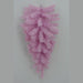 The 24" Pink Artificial Pine Teardrop Swag (82298-PK) features a cluster of pastel pink artificial pine branches elegantly arranged in a downward fan shape, creating a striking teardrop silhouette against a simple gray backdrop—ideal for adding seasonal charm to your decor.