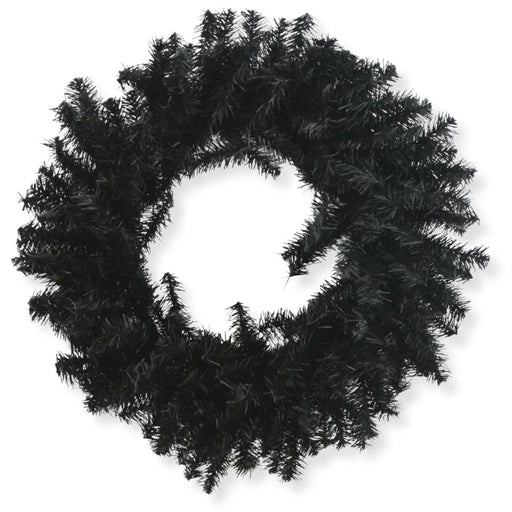 The 24" Black Artificial Pine Wreath 82295-BK features dense, spiky branches in a circular design, ideal for Halloween wreath displays or bringing a touch of gothic décor to your space. Shown against a striking white background.