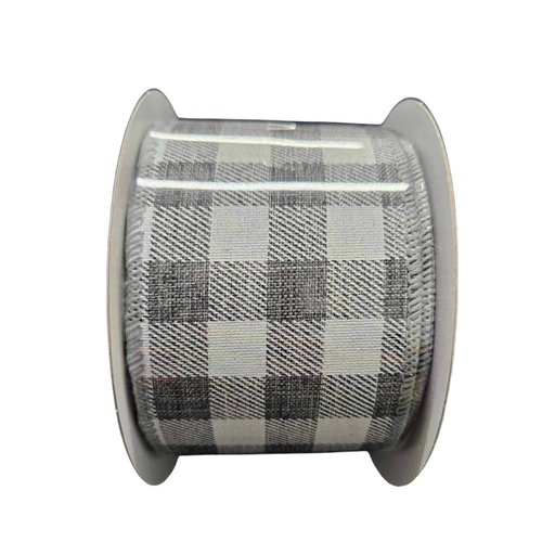 Meet the 2.5X10Y Grey White Check Ribbon C2340-078, featuring a striking black, gray, and white checkered pattern with large alternating squares on a spool. Its intricate design is perfect for any creative project!.