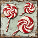 A rustic weathered wooden board with a distressed teal finish features three large red and white swirled peppermint lollipops, enhancing the vintage charm of this 10" x 10" Peppermint Lollipops Sign (TTE-002).
