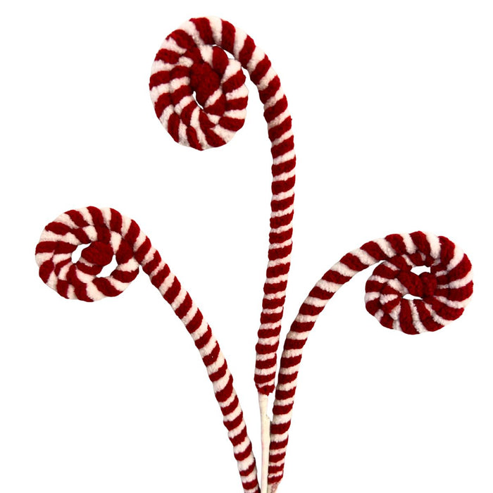 Red and white peppermint swirl Christmas spray with three curled striped stems.