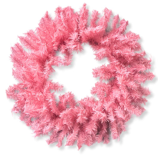 A 24" Pink Artificial Pine Wreath (82295-PK), crafted from light pink artificial pine branches and arranged in a perfect circle against a plain light background, adds a unique and stylish touch to your seasonal décor.