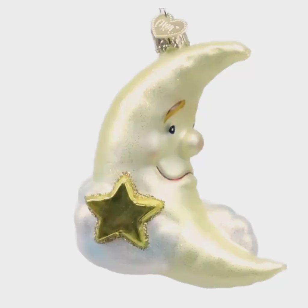 Mister Moon Old World Christmas glass ornament featuring a smiling crescent moon with soft blue clouds and a golden star, baby keepsake ornament 22047.