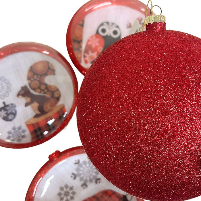 Close-up of RAZ Exclusive glass disc ornaments showing the red glittered back and side view of the woodland animal designs — owl, squirrel, fox, and deer. Made of glass, 6 inches. Available at Trendy Tree.