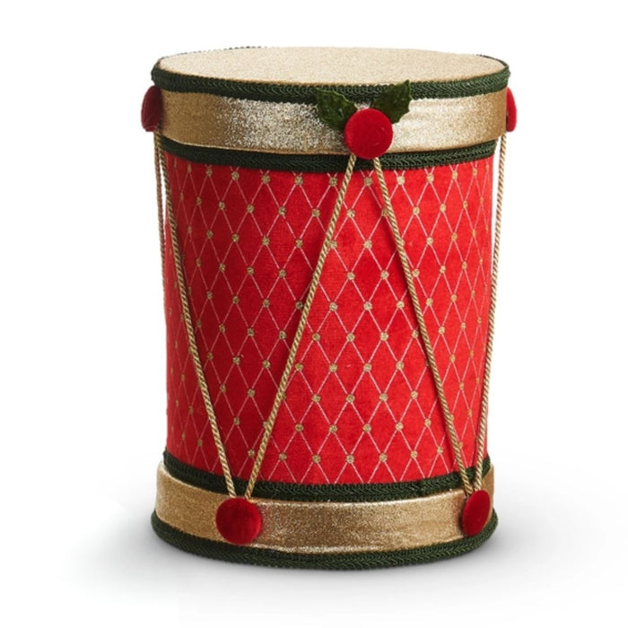 Add festive charm to your Christmas decor with the 12″ Red or Green Velvet Christmas Drum (RAZ 4603582). Available in red or green velvet, each drum features elegant gold trim, bright red pom-poms, and a crisscrossed gold string pattern. Inspired by the classic RAZ Imports design, these decorative accents stand upright on a white background and bring timeless holiday cheer to any space.