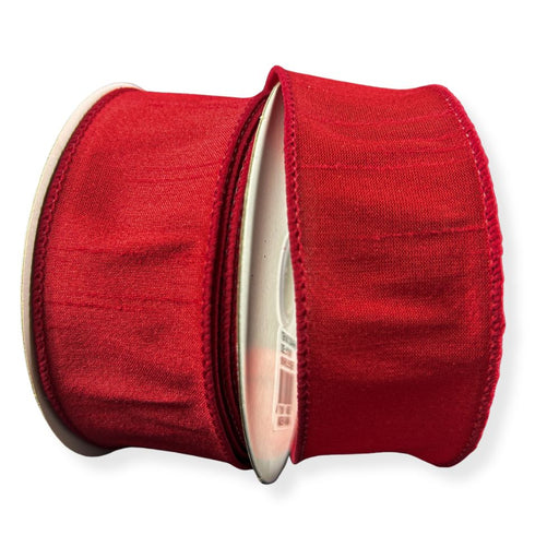 Two rolls of 1.5" Red Faux Dupioni Wired Ribbon (10 Yards, 72434-09-12) are placed side by side against a white background. The ribbons feature a subtle sheen, textured finish, and wired edges—making them perfect for adding an elegant touch to Christmas decorations.