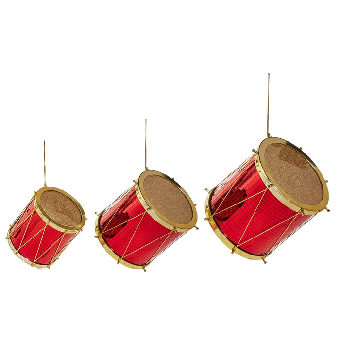 Three Red & Gold Christmas Drum Ornaments – 3 Sizes (RAZ 4516726) hang from strings against a white background, making festive holiday decorations and charming Christmas drum ornaments.