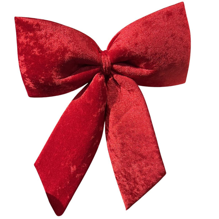 Red velvet 3D hanging Christmas bow measuring 14 by 17 inches with long tails.