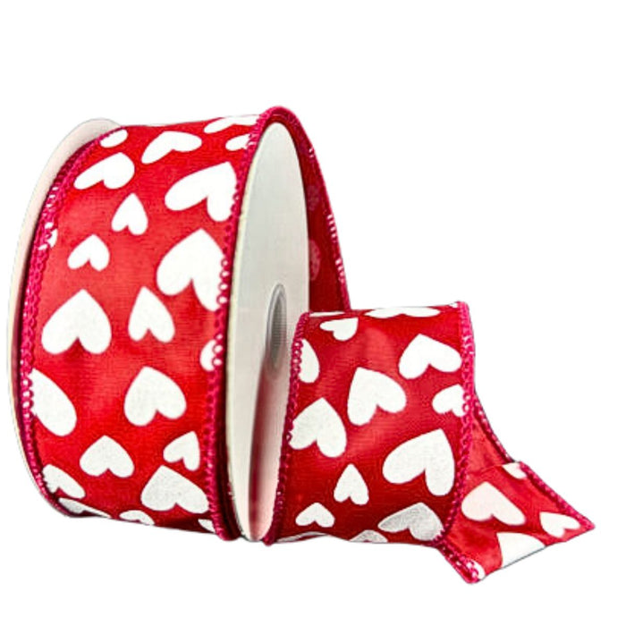 Roll of red satin wired ribbon with scattered white heart pattern, measuring 1.5 inches wide, partially unrolled to show texture and shape.