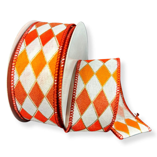 Ivory wired ribbon with rust and orange harlequin diamond pattern, 1.5 inches wide.