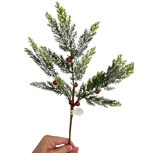 Snowy evergreen Christmas spray accented with red glitter berries.