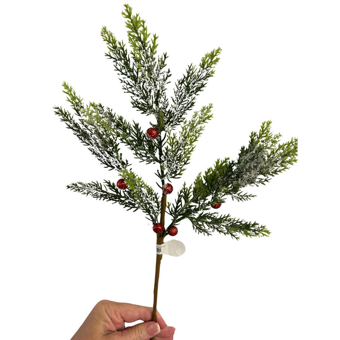 Snowy evergreen Christmas spray accented with red glitter berries.