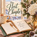 Flat metal sign TTE-892 featuring The Next Chapter lettering, an open journal with And So the Adventure Begins wording, gold-accented mug, white hydrangeas, winter greenery, and snowy countryside.