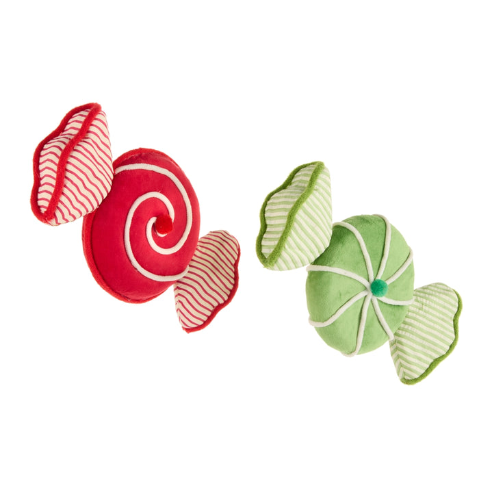 Two plush ornaments designed to look like wrapped candies—one red with a white swirl and one green with white stripes—rest on a white background. The 9.25″ Velvet & Seersucker Candy Ornament from RAZ Imports (item 4603590) brings vibrant color and soft texture to your holiday décor, making it perfect for adding a festive, candy-inspired accent to your Christmas tree or seasonal displays.