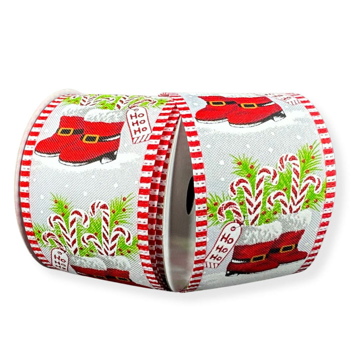 White linen Christmas ribbon with red Santa boots filled with candy canes, greenery, Ho Ho Ho tags and red striped wired edges.
