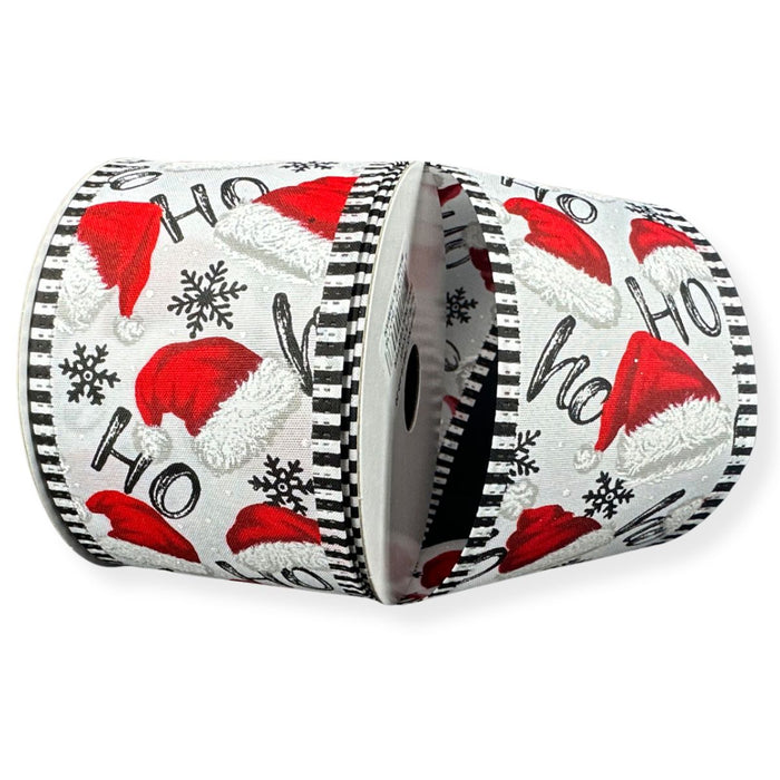 White Christmas ribbon with red Santa hats, Ho Ho Ho lettering, black snowflakes and black and white striped wired edges.