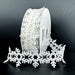 White felt snowflake cutout ribbon with connected dimensional snowflakes, 1.5 inches by 10 yards.
