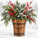 Winter metal sign featuring a rustic wooden bucket filled with snow-covered pine and cedar greenery, bright red berries, and a soft snowy woodland background, TTE-884.