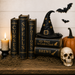 TTE-469 Halloween metal sign featuring vintage spellbooks, a black witch hat, candle, bats, pumpkin, skull, and antique Halloween décor accents.