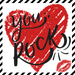 Red heart with 'you rock' text and a kiss mark on a black and white striped background, 10" metal sign for wreaths or for framing.