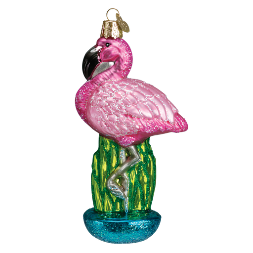 The Flamingo Ornament Old World Christmas 16023 showcases a glittery pink flamingo, gracefully balanced on one leg on a lush green cactus, complete with a gold hanging hook.
