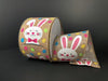 Presenting the 2.5"X10Y Natural Printed Muslin/Happy Bunny, a delightful roll of wired decorative ribbon featuring a bunny with a pink bow tie and colorful polka dots. Set against natural printed muslin, this charming design adds a whimsical touch to any project.