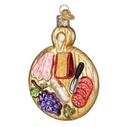 The Charcuterie Board Old World Christmas Ornament 32486 is a festive decoration shaped like a charcuterie board. It features miniature meats, cheese, and vegetables on a wooden-like base with a golden handle—ideal for French cooking enthusiasts.