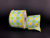 The 2.5X10Y Yellow Blue and Green Plaid Print Linen Ribbon (41327-40-04) is shown on a black background, partially unwound to exhibit its vibrant checkered pattern.
