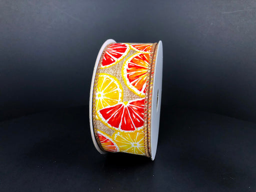 A spool of 1.5x10Y natural print linen ribbon features vibrant lemon and orange citrus slice patterns against a dark background, product code 41334-09-14.