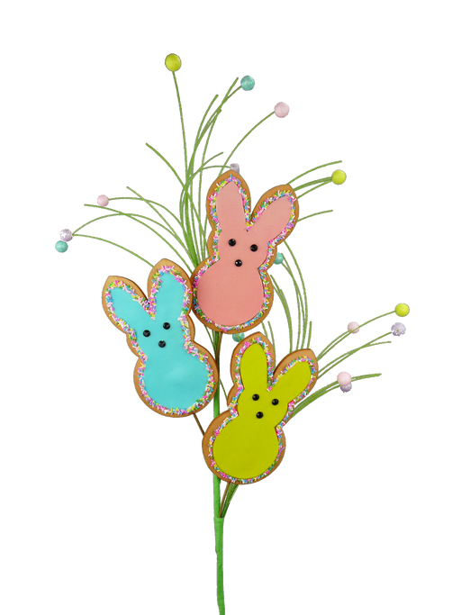 The 27" Bunny Cookie Spray with 3 Stems 62901EAS features an array of colorful, bunny-shaped cookies on long sticks, creating a bouquet-like appearance. These bunnies in soft pastel hues of blue, pink, and yellow with sprinkle-edged details perch atop three stems accented with small pastel balls, adding a festive flair against the gray backdrop.