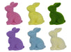 Six 10"H X 8.25"L flocked sitting rabbit figurines, made from polystyrene and nylon in assorted pastel colors—purple, pink, cream, green, blue, and yellow—are arranged in two rows against a plain background.