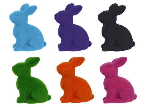 Six 10x8.25 flocked sitting rabbit figurines made of polystyrene and nylon come in assorted colors: purple, pink, black, green, orange, and turquoise. The rabbits sit facing left in two rows of three.