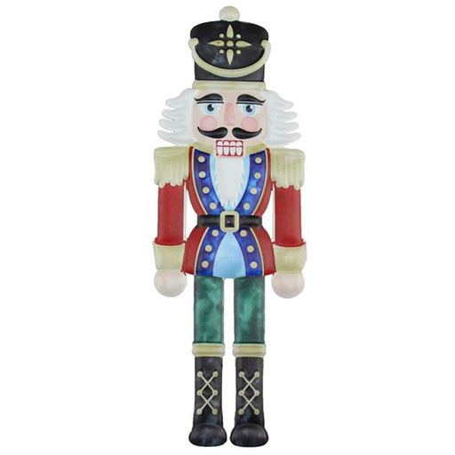 This 12" Nutcracker Embossed Metal Christmas Sign MD0619 features an illustration of a nutcracker soldier with a black hat, blue jacket, red sleeves, and green pants. The classic woodcut design highlights his white beard and rosy cheeks, making it an ideal festive decoration.