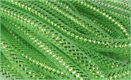 Close-up of intricately woven lime green netting with embedded shining lights, creating a textured lit pattern reminiscent of Deco Flex Tubing Lime Green with Lime Green Metallic Foil RE300456.