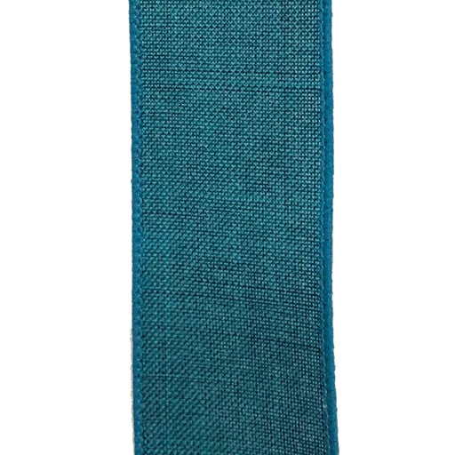 A close-up of the 2.5 Turquoise Canvas Ribbon X314840-39 reveals its textured woven fibers, slightly rough finish, and neatly sewn edges. Vertically aligned against a plain white background, this wired ribbon showcases a structured yet elegant appeal.