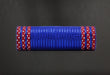 The 10X10Y Royal Blue Metallic mesh (XB108010-25) is rolled and features red and white star patterns on the edges, set against a dark background.