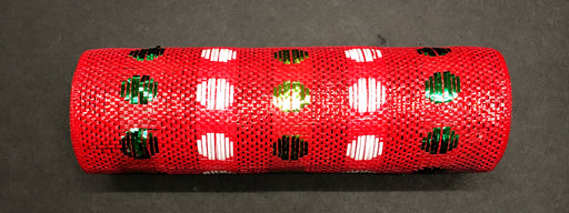 A Polka Dot Red-Green-White Woven Mesh, 10X10Y (XB108410-09), is wrapped around a cylindrical object and placed on a dark surface; the mesh features shiny red material with metallic white and green polka dots.