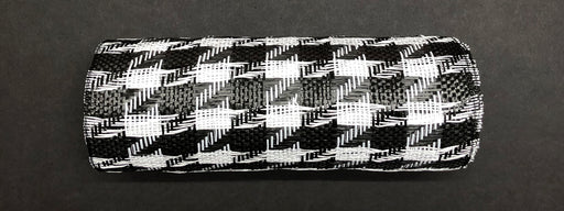 The Houndstooth Black-White Woven Mesh, model XB108910-01, features a bold houndstooth pattern as it lays horizontally on a dark background, highlighting its textured checkered design.