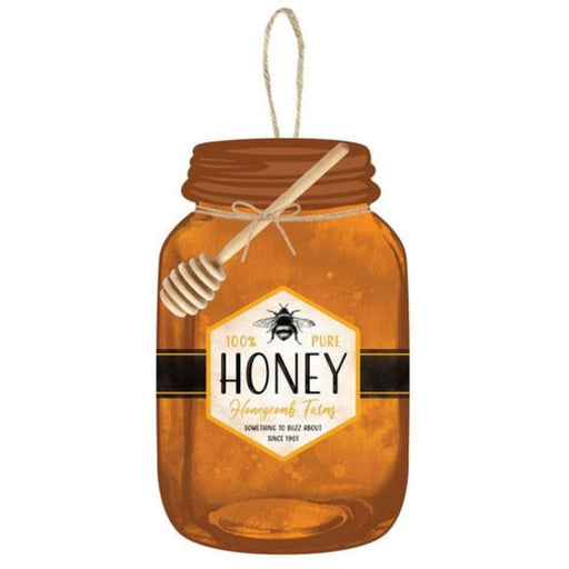 The 10H x 6L Honey Mason Jar Sign (AP7173) in rust, golden yellow, mustard, and black features a honey dipper lid and a 100% Pure Honey, Honeycomb Farms label with a bee graphic. The transparent amber tone hints at the sweet nectar inside.