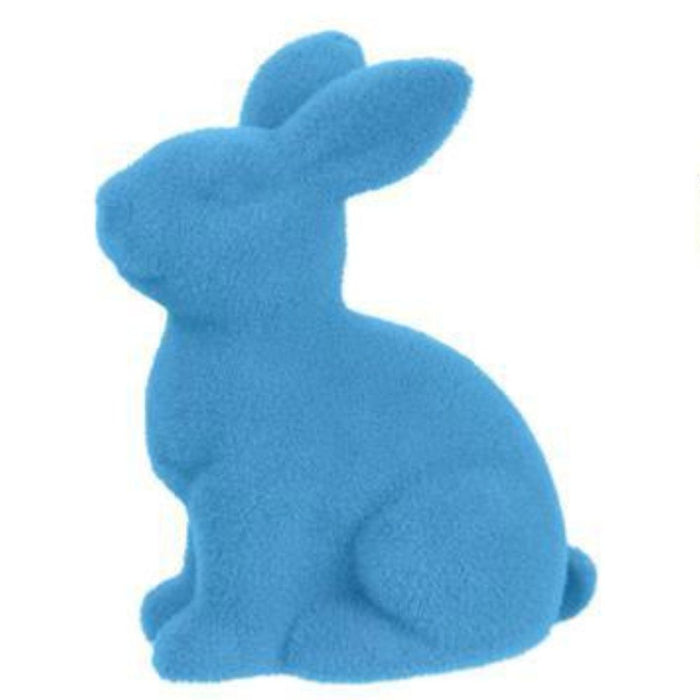 This 10H x 8.25L Flocked Sitting Rabbit figurine, crafted from polystyrene and nylon with a smooth, abstract design, has elongated ears and a rounded body. Available in purple, pink, black, green, orange, and turquoise HE723199 colors for a vibrant touch to any setting.