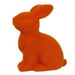 The 10H x 8.25L Flocked Sitting Rabbit, available in assorted colors including orange, features a fuzzy texture and is crafted from polystyrene. It sits facing left against a white background. Product code: HE723199.