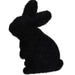 The 6Hx3.5L Flocked Standing Rabbit, made from polystyrene and nylon, is available in six assorted colors: purple, pink, orange, green, turquoise, and black. It features a silhouette of a sitting rabbit against a plain white background.