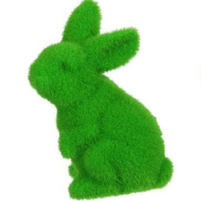 A 6 H x 3.5 L flocked standing rabbit figurine in assorted colors, including green, stands upright on its hind legs in profile. Featuring a whimsical texture reminiscent of grass or soft fur, its similar to polystyrene art. Product: HE724099.