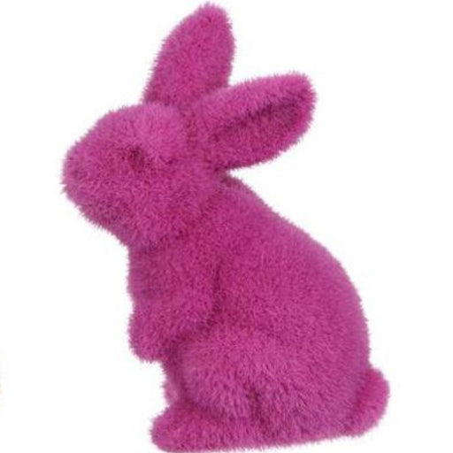A plush, flocked standing rabbit in vivid pink with soft fur and large ears, shown in profile against a plain white background. Packaged as part of the 4Hx2.5L Flocked Standing Rabbit collection (6 assorted colors: Purple, Pink, Black, Green, Turquoise, Yellow). Product Code: HE723899.