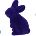 A 6Hx3.5L flocked standing rabbit figurine in purple, made from polystyrene and nylon, is sitting upright against a white background.