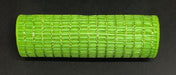 A vibrant Lime Metallic Wide Weave Mesh, 10X10Y is rolled up against a black backdrop. Made from polypropylene, its sleek and modern design features evenly spaced vertical and horizontal lines.