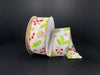 A roll of White Linen/Sparse Red-Green-Gold Berries ribbon, 1.5X10Y, features gold edges and a design of pine cones, holly leaves, and berries on a dark background.